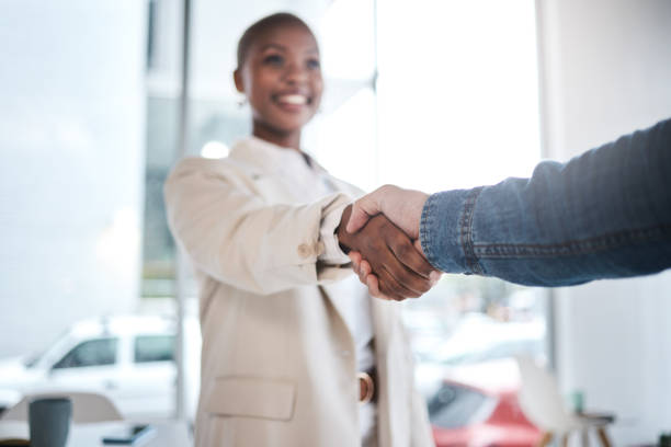 istock Black woman, handshake and meeting in partnership, support or trust for teamwork or unity at office. African female person or employee shaking hands for introduction, agreement or deal at workplace 1553114738