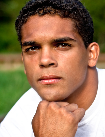 A handsome young man with an intense gaze. High School yearbook photo.