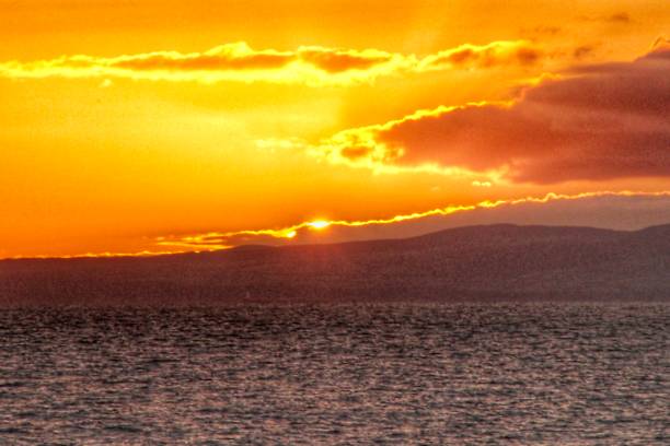 istock Golden Glow of a Scottish Seaside Evening 1553129768