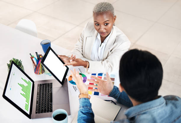 istock Tablet, collaboration and business people communication, discussion and working on trend research, feedback or data. Mockup screen, partnership or creative media team cooperation on insight analytics 1553143767