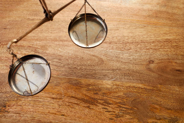 istock Law scales on table. Symbol of justice 1553145084