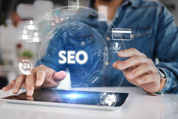 istock Hands, business and tablet for seo hologram, networking and 3D world graphic for target audience research. Closeup worker, person or digital technology of globe overlay for search engine optimization 1553148121