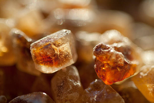 raw cane sugar stock photo