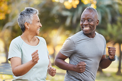 Fitness, morning and running with old couple in park for Health, workout and exercise. Wellness, retirement and happy with senior black man and woman in nature for motivation, sports and cardio