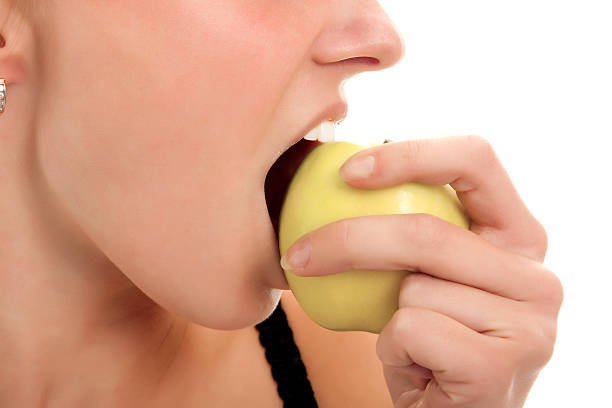 istock Woman eating apple. 155315876