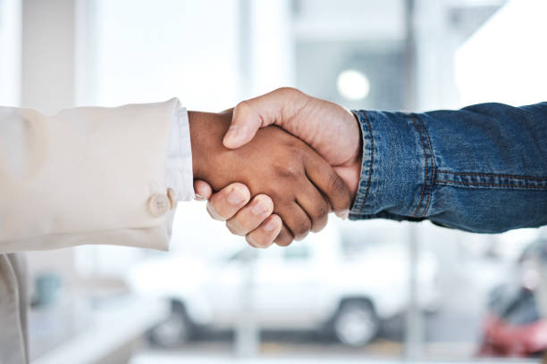 istock Business people, handshake and meeting in partnership, support or trust for teamwork or unity at the office. Employees shaking hands for introduction or greeting in agreement or deal at the workplace 1553163823