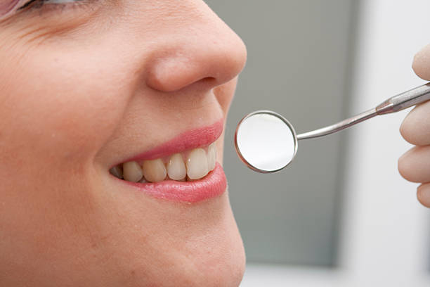 istock woman on reception at the dentist. Close-up 155316440