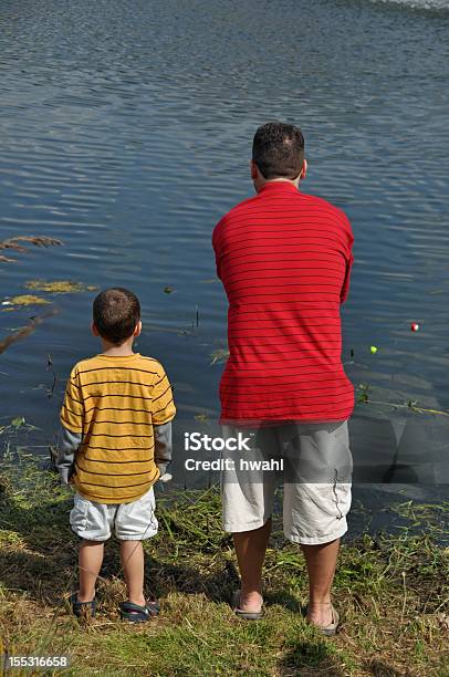 Teach A Boy To Fish Stock Photo - Download Image Now - Adult, American Culture, Beach