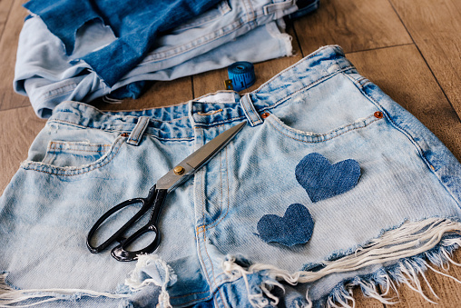 Recycle, reuse, repurpose, upcycle, upgrade concept. New life to old things, make your own clothes from jeans