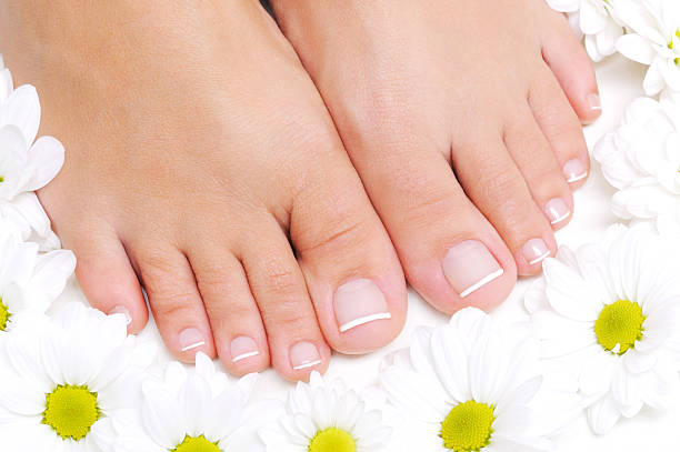istock Flowers around beautiful female feet 155317069