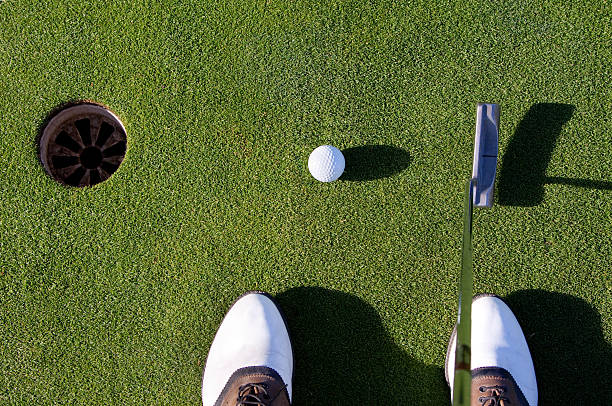 istock First person view of putting on a golfing green 155317113