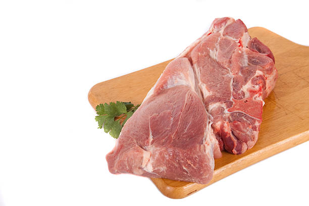 istock Fresh pork meat on wooden board with parsley 155317200