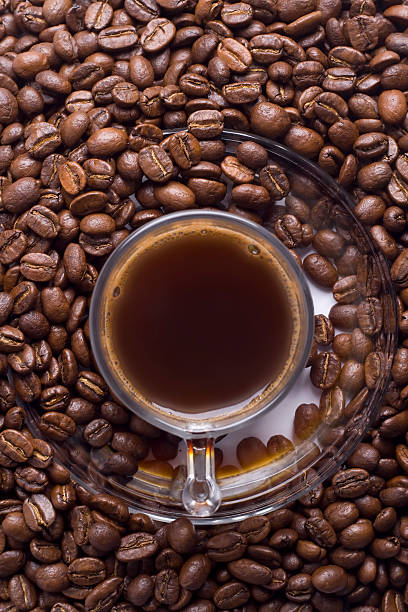 Glass cup of Turkish coffee and beans stock photo