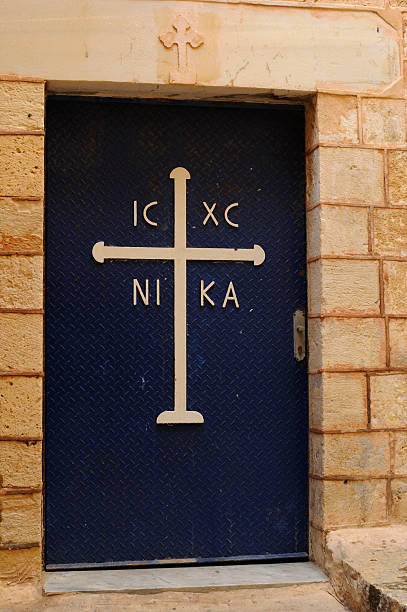 istock Old church blue door with cross 155317712