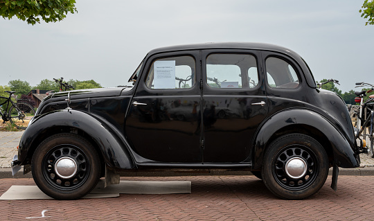 Epernay, France - July 23 2020: A Fleur-de-Lys Newark parked outside a building.