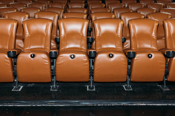 istock Rows of green brown seats in assembly hall 1553184586