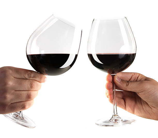 istock red wine glasses in toast gesture 155318710