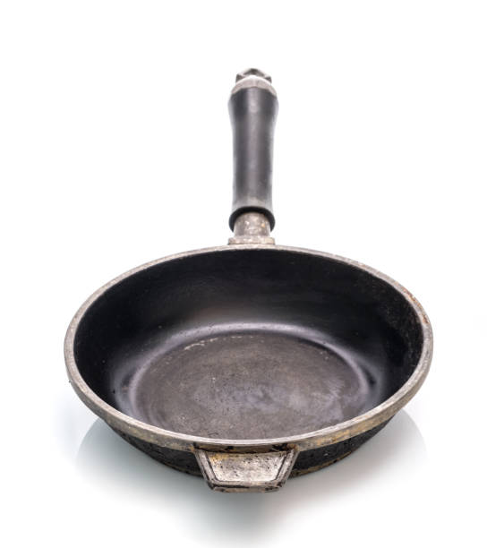 istock Small cast iron frying pan isolated on white background 1553187754