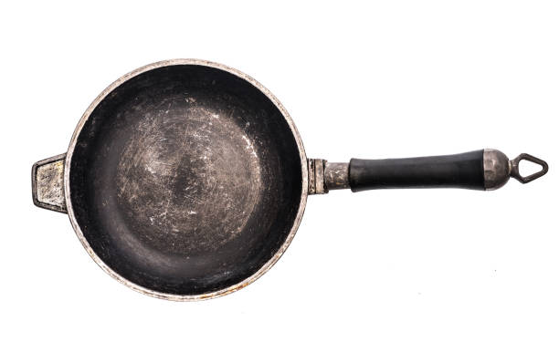 istock Small cast iron frying pan isolated on white background 1553187760