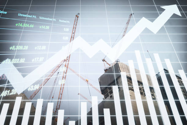 istock Image of tower crane  working on top of the  buildings with graph, chart and candlesticks data for stock business and construction industry presentation background. 1553188322