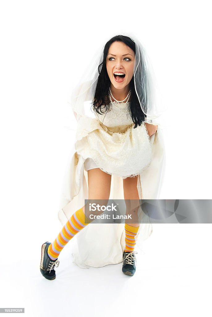 Eccitato giovane sposa Indossa scarpe sportive - Foto stock royalty-free di Abbigliamento