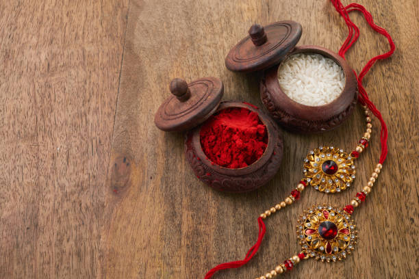 istock Raksha Bandhan background with Rakhi string, Rice Grains and Kumkum 1553205184