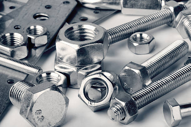 Fasteners Close-up of various steel nuts and bolts fastening photos stock pictures, royalty-free photos & images