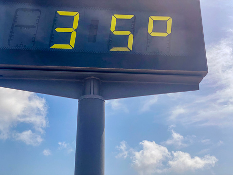 Low angle view of billboard showing 35 degrees celsius of temperature in the city of Valencia, Spain