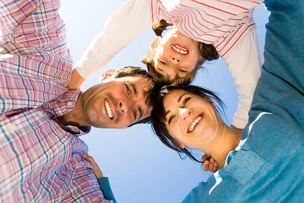istock Happy family forming a huddle 155321857