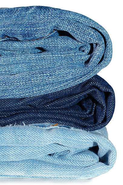 Stack of blue jeans outerwear. stock photo