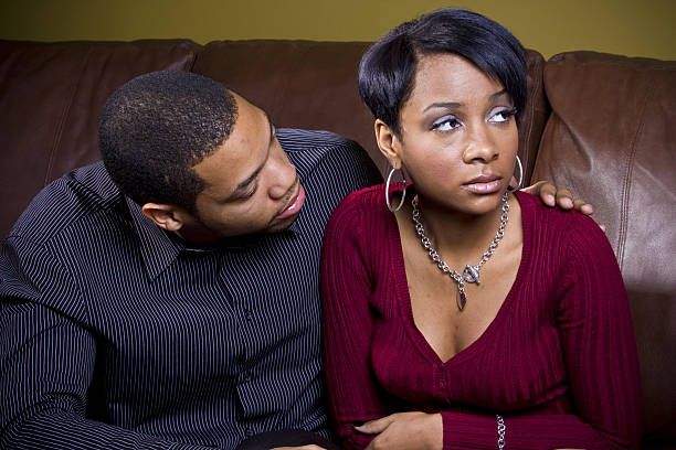 istock man tries to consol his sad lover 155322383