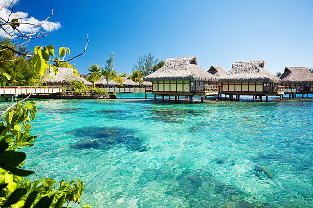 istock Over water bungalows next to amazing lagoon 155322640