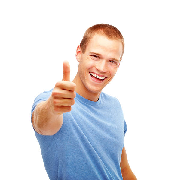Happy young guy showing thumbs up sign Happy young guy showing thumbs up sign stars in your eyes stock pictures, royalty-free photos & images