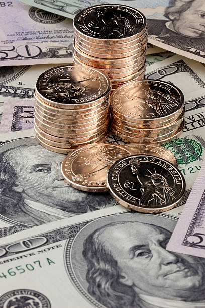 istock Gold Coins Stacked on Paper Bills 155322852