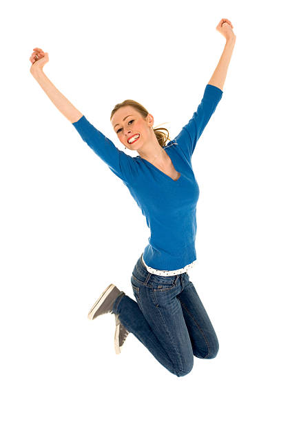 istock Teenager jumping with arms raised 155322935