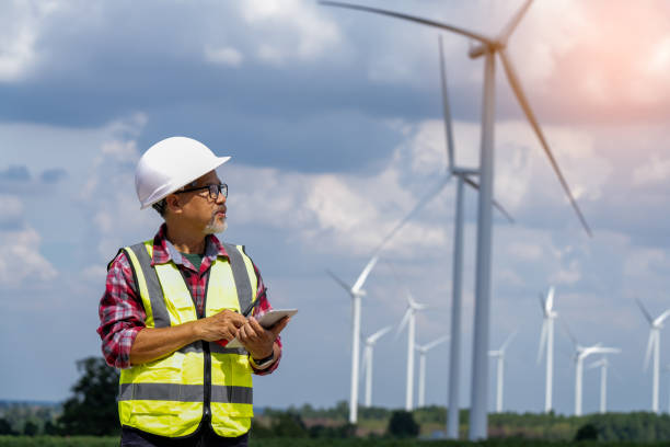 istock male engineer planning on wind turbine maintenance work, nature renewable energy concept, wind power 1553230627
