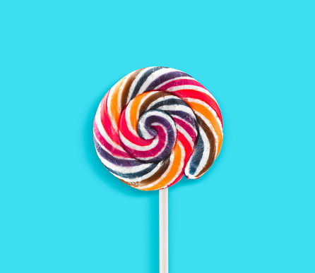 Colorful lollipops on blue background