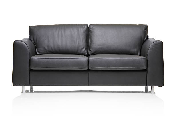 A modern black leather sofa isolated on a white background Image of a modern black leather sofa over white background leather couch stock pictures, royalty-free photos & images