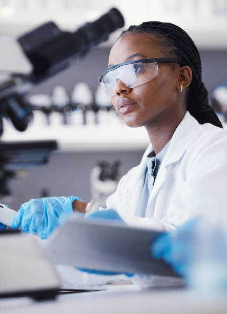 istock Computer, black woman or scientist reading research for online analysis, sustainability or innovation. Science, studying biotechnology or African ecology expert in a laboratory for agro development 1553232865