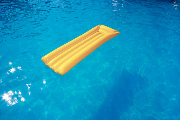 istock yellow mattress in the pool 155323304