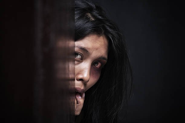 istock Abused woman hiding in dark 155323691
