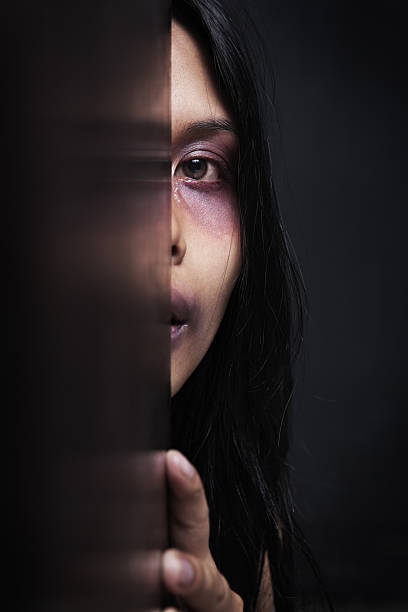 istock Abused woman hiding in dark 155323699
