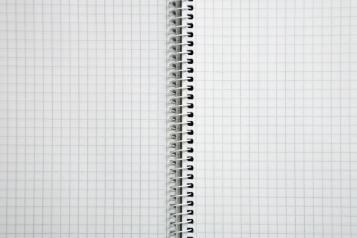 Photo of an empty spiral checked notebook