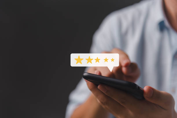 istock Happy Customers Rating and Review Evaluation Feedback Analysis in Customer Satisfaction Survey Results Five Stars Rating online application. 1553246884