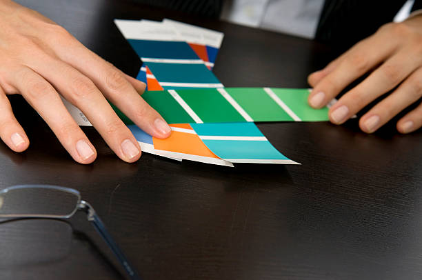 Woman's Hands Picking Out Swatches stock photo