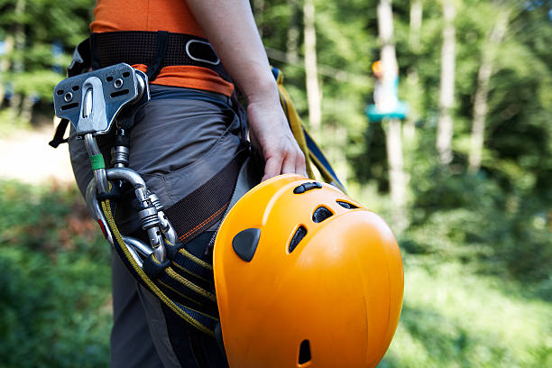 zip-line gear professional climbing gear with helmet pulley and carabiner fruit bat photos stock pictures, royalty-free photos & images