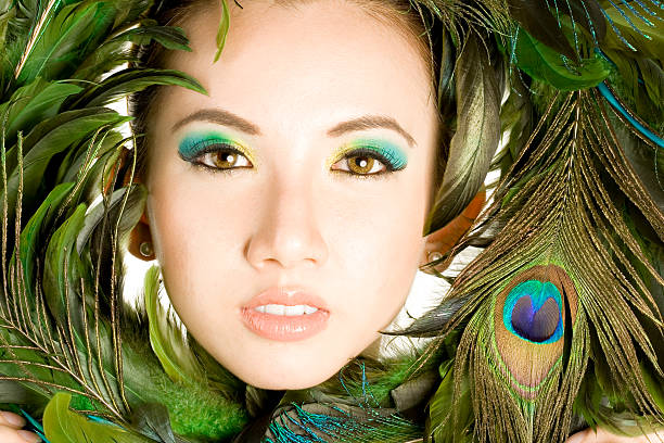 woman hazel eye macro shoot with blue and pink makeup.false feather eyelashes.