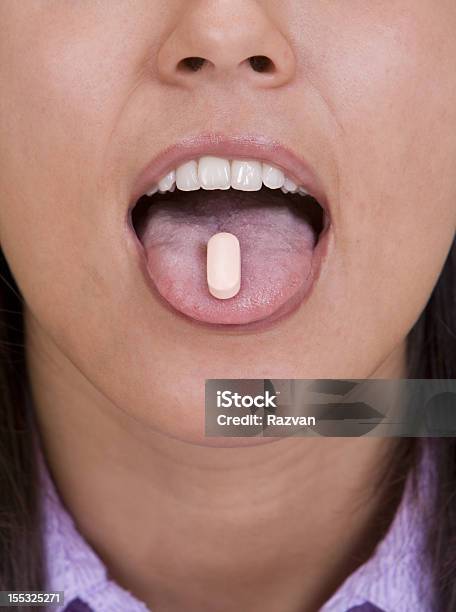 Pill On The Tongue Stock Photo - Download Image Now - Adult, Adults Only, Capsule - Medicine