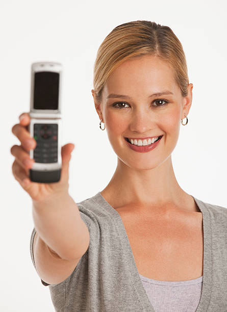 istock female showing cell phone to camera 155325444