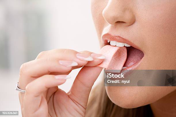 Taking Chewing Gum Stock Photo - Download Image Now - Bubble Gum, Eating, Women